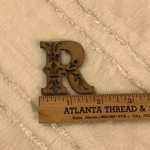 Wood laser-cut initial ‘R’. Light color wood with perfectly stained edges 1 3/4”